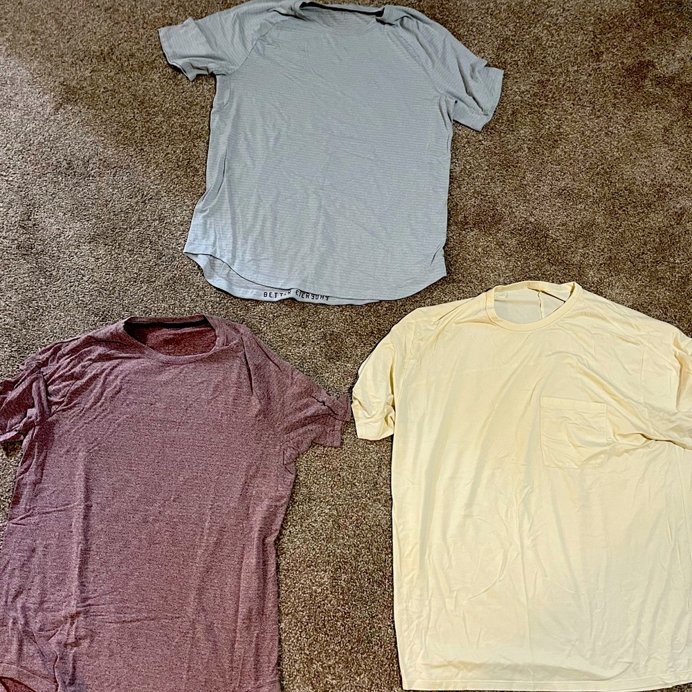 Lululemon t-shirt bundle Red, Grey, and Yellow. Yellow T-shirt has front pocket